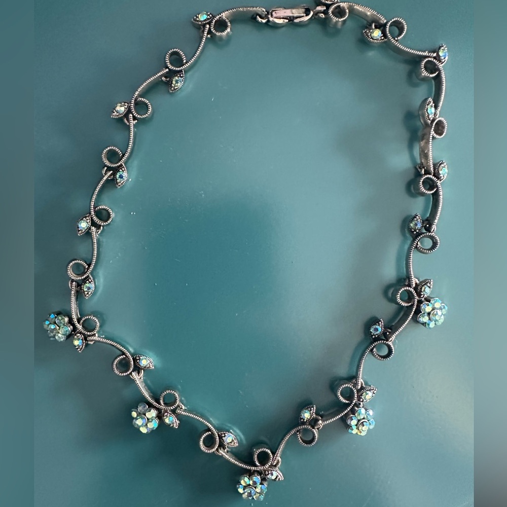 Vintage costume silver necklace choker with iridescent, blue leaves and flowers